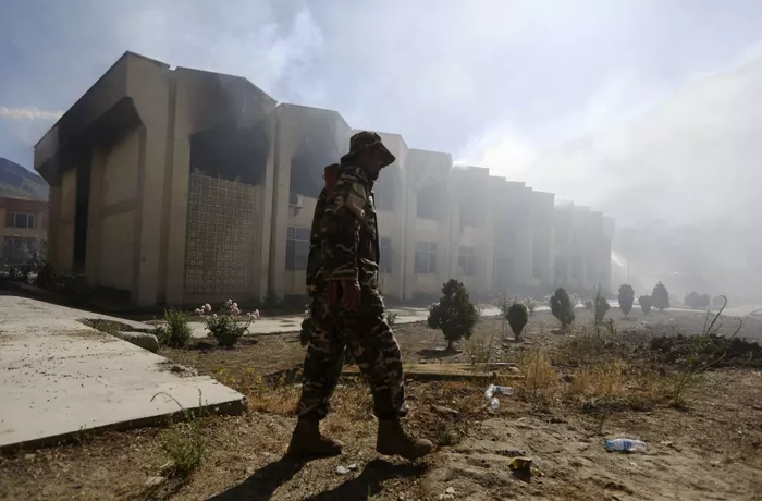 an afghan security officer walks in front of a panjshir government building after an attack by insurgents in panjshir province may 29 2013 photo reuters an afghan security officer walks in front of a panjshir government building after an attack by insurgents in panjshir province may 29 2013 photo reuters