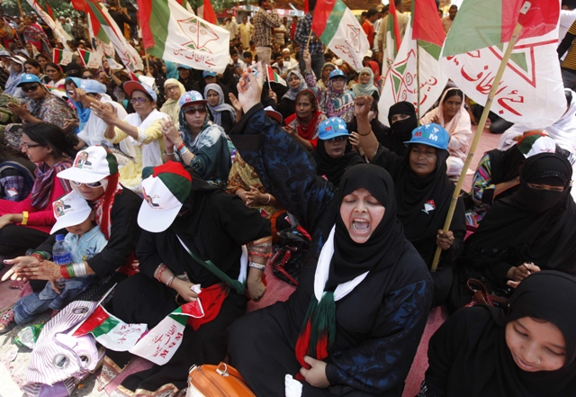 mqm supporter stage a sit in in front of the election commission of pakistan office in karachi on may 15 2013 photo reuters