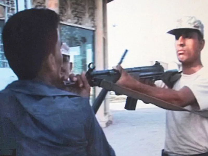 a rangers personnel holds sarfaraz shah at gunpoint before shooting the 19 year old boy the whole episode was captured by a television camera photo file a rangers personnel holds sarfaraz shah at gunpoint before shooting the 19 year old boy the whole episode was captured by a television camera photo file