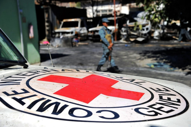 in a file picture taken on may 30 2013 an afghan policeman stands guard beside the burnt out wreckage of vehicles of the international red cross after an attack in jalalabad photo afp in a file picture taken on may 30 2013 an afghan policeman stands guard beside the burnt out wreckage of vehicles of the international red cross after an attack in jalalabad photo afp