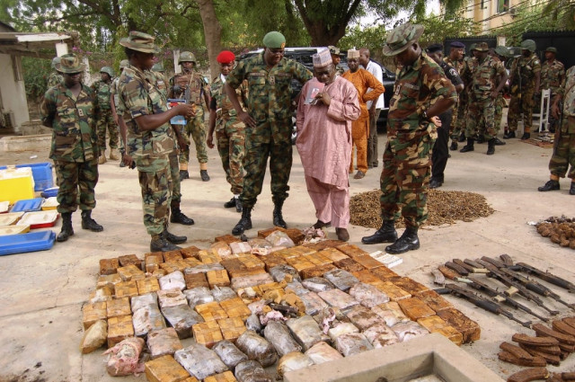 military officials stand near ammunition seized from suspected members of hezbollah after a raid of a building in nigeria 039 s northern city of kano may 30 2012 photo reuters military officials stand near ammunition seized from suspected members of hezbollah after a raid of a building in nigeria 039 s northern city of kano may 30 2012 photo reuters