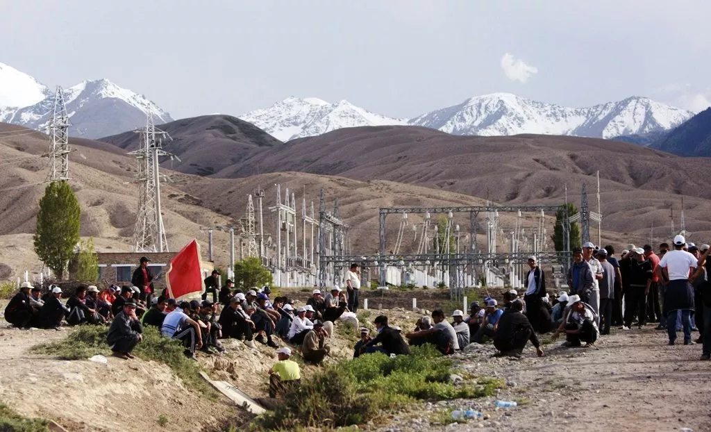 protesters gather with a power substation in the background near the village of tamga in dzhety oguz district may 31 2013 photo reuters protesters gather with a power substation in the background near the village of tamga in dzhety oguz district may 31 2013 photo reuters