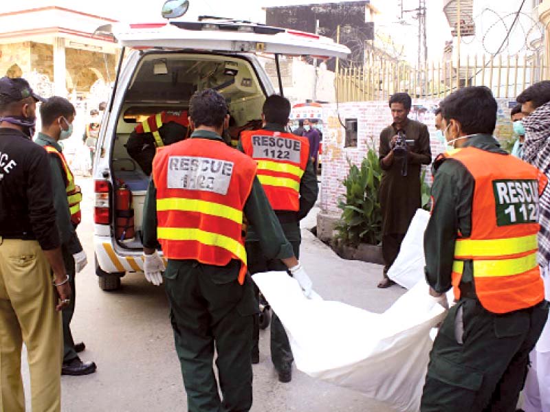 rescue 1122 workers loading dead bodies of a male and 3 female in an ambulance found from a house in sadiqabad area on saturday photo muhammad javaid express