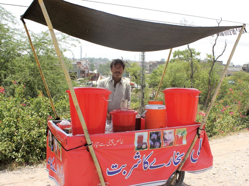 water carriers and juice vendors are in high demand during summers photo waqas naeem express