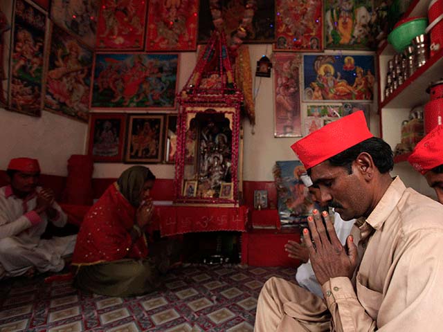 members of hindu community pray inside a temple in rahim yar khan march 27 2014 photo reuters