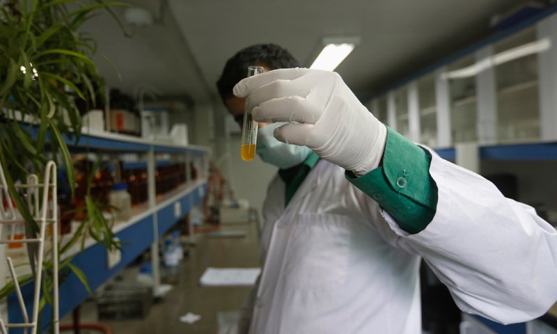 an afghan pharmacist analyses samples of drugs photo reuters