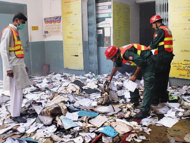 rescue personnel sift through the burnt documents photo online rescue personnel sift through the burnt documents photo online