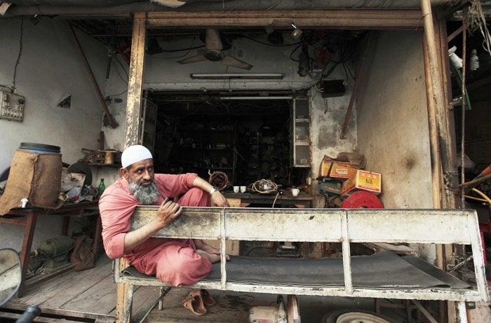 mohammad ramzan an electric motor mechanic sits outside his shop during power outage in rawalpindi june 3 2013 photo reuters