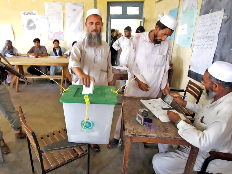 a tribesman casts his vote in jamrud photo inp