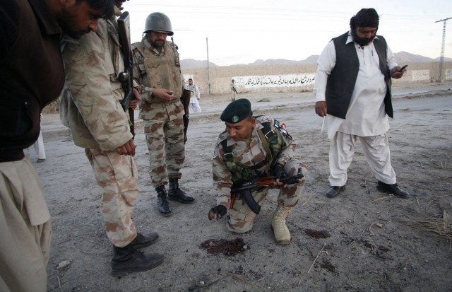 file photo of paramilitary soldiers surveying a bomb attack site in quetta december 10 2012 photo reuters file file photo of paramilitary soldiers surveying a bomb attack site in quetta december 10 2012 photo reuters file
