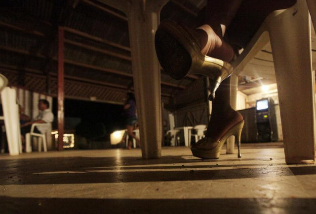 a prostitute wearing stiletto heels waits for customers at a bar in jaci parana near the brazilian town of porto velho the capital of western amazon 039 s rondonia state november 18 2009 photo reuters a prostitute wearing stiletto heels waits for customers at a bar in jaci parana near the brazilian town of porto velho the capital of western amazon 039 s rondonia state november 18 2009 photo reuters