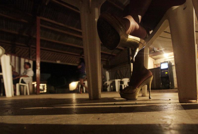 a prostitute wearing stiletto heels waits for customers at a bar in jaci parana near the brazilian town of porto velho the capital of western amazon 039 s rondonia state november 18 2009 photo reuters