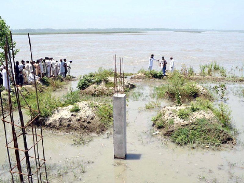 locals inspect fields and houses in guladad charsada flooded by the overflowing jinday river photo app