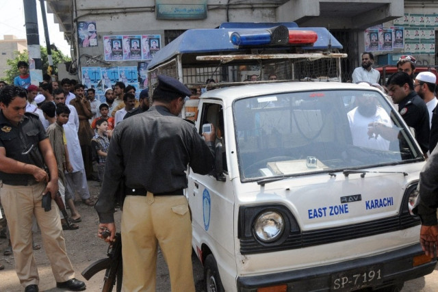 police officers examine a police van after an attack by gunmen in patel para area of karachi on june 9 2013 photo afp police officers examine a police van after an attack by gunmen in patel para area of karachi on june 9 2013 photo afp