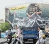 iranian walks past a giant billboard reading the strait of hormuz remains closed at revolution square in tehran photo afp