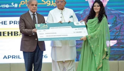 prime minister shehbaz sharif distributes a cheque to a beneficiary during a ceremony in islamabad photo app