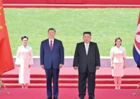 chinese president xi jinping and north korean leader kim jong un watch a march past in pyongyang photo reuters