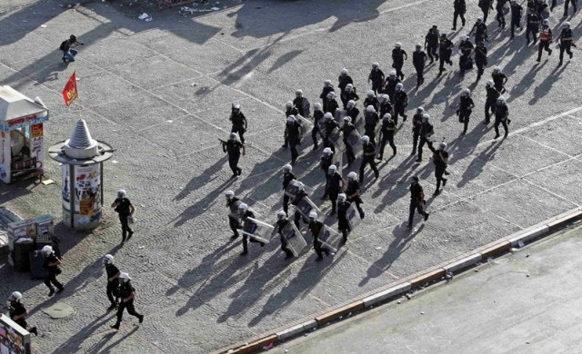 turkish riot police secure the area during a protest at taksim square in istanbul june 11 2013 photo reuters turkish riot police secure the area during a protest at taksim square in istanbul june 11 2013 photo reuters