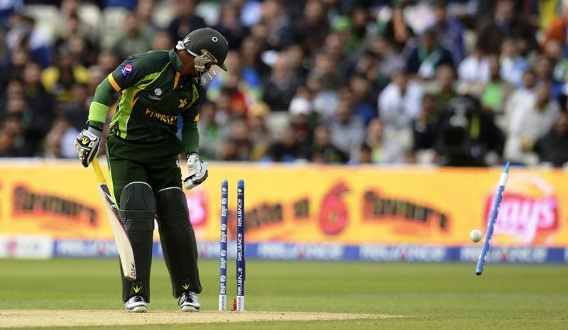 farhat is bowled by morris during the icc champions trophy group b match photo reuters