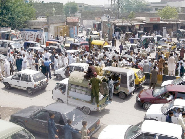 residents of rashidabad block the street while protesting on charsadda road photo ppi residents of rashidabad block the street while protesting on charsadda road photo ppi