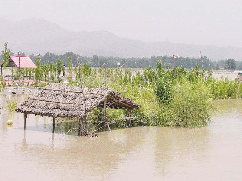 a roadside hut partially submerged due to a rise in the swat river s water level photo online