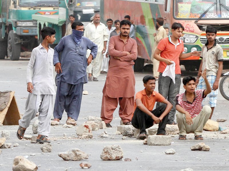 lyari residents gathered at mauripur road on wednesday to protest the continued lawlessness and unrest during the last few days photo athar khan express