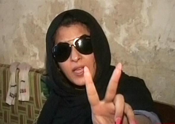 a screengrab shows laila 039 s gestures as she sits at the police station in multan screengrab express news