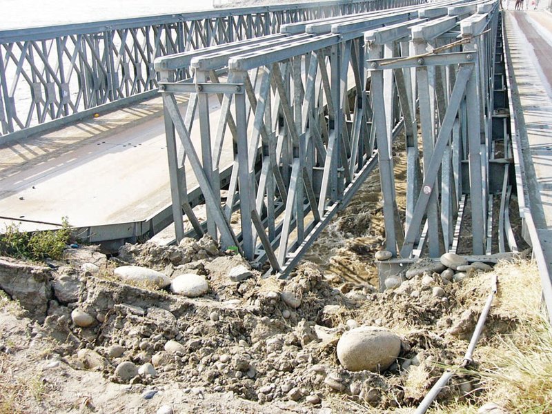 the original bridge was destroyed and washed away in the july 2010 floods following which a temporary make shift bridge was installed photo online