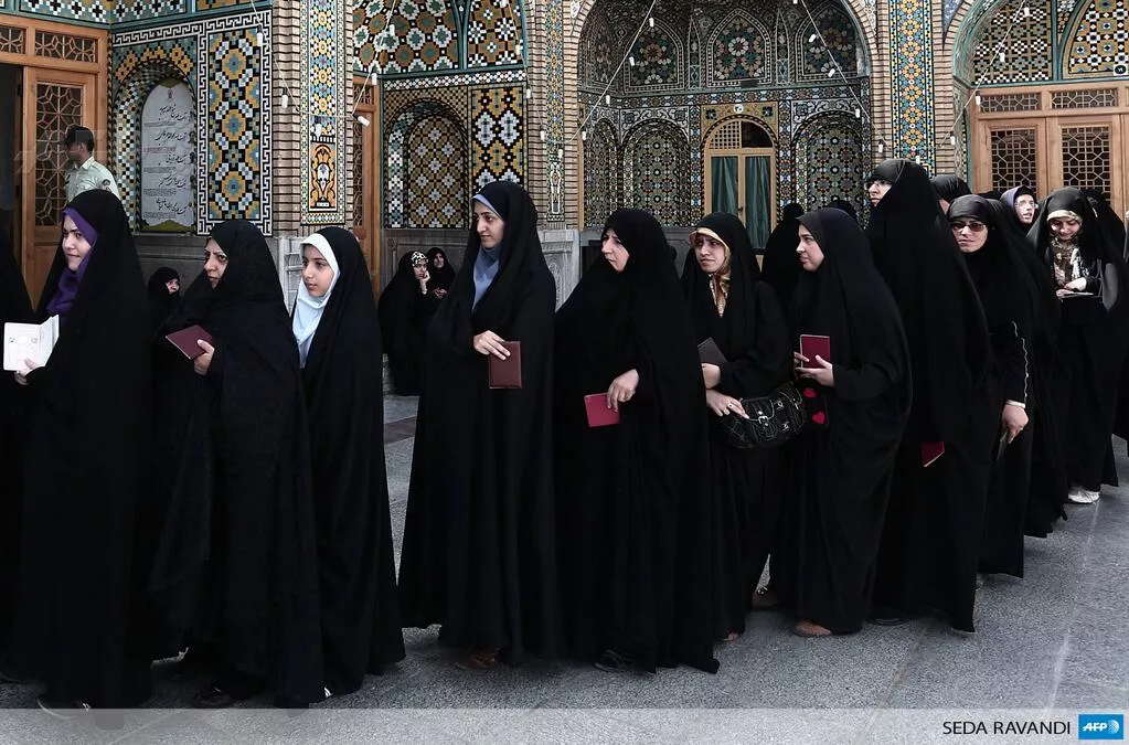 iranian women wait to vote at a polling station at the massoumeh shrine in the holy city of qom photo afp iranian women wait to vote at a polling station at the massoumeh shrine in the holy city of qom photo afp