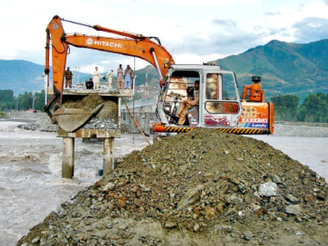 khyber pakhtunkhwa highway authority officials repair the khawazakhela bridge which partially collapsed due to flooding in swat river photo online khyber pakhtunkhwa highway authority officials repair the khawazakhela bridge which partially collapsed due to flooding in swat river photo online