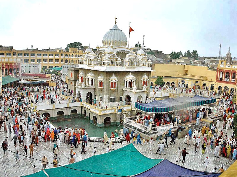 sikh pilgrims at panja sahib for religious rituals photo file