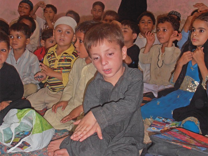 around 30 children gather in a ten by ten room to take tutions at the possibilites school opened by 19 year old sohail khan photo express