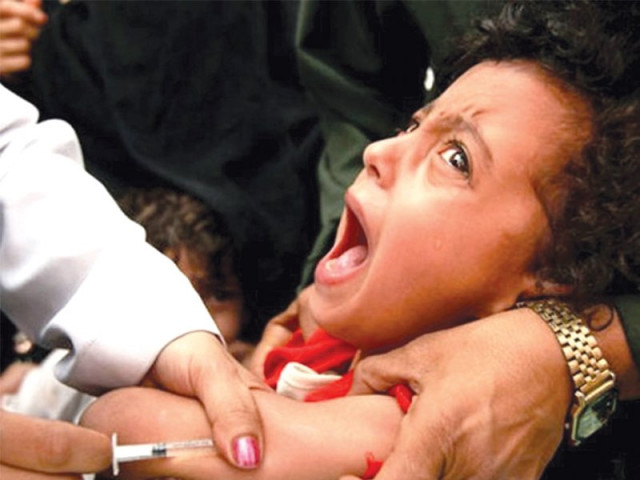 a child being innoculated against measles photo file a child being innoculated against measles photo file