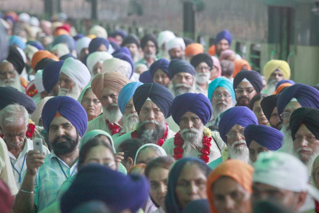 sikh pilgrims were visiting pakistan for the 407th martyrdom day of guru arjun dev jee at the gurdwara dera sahib on sunday photo afp sikh pilgrims were visiting pakistan for the 407th martyrdom day of guru arjun dev jee at the gurdwara dera sahib on sunday photo afp