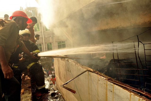 bangladeshi firefighters try and control a fire that broke out at a garment factory on the outskirts of dhaka on november 26 2012 photo afp bangladeshi firefighters try and control a fire that broke out at a garment factory on the outskirts of dhaka on november 26 2012 photo afp