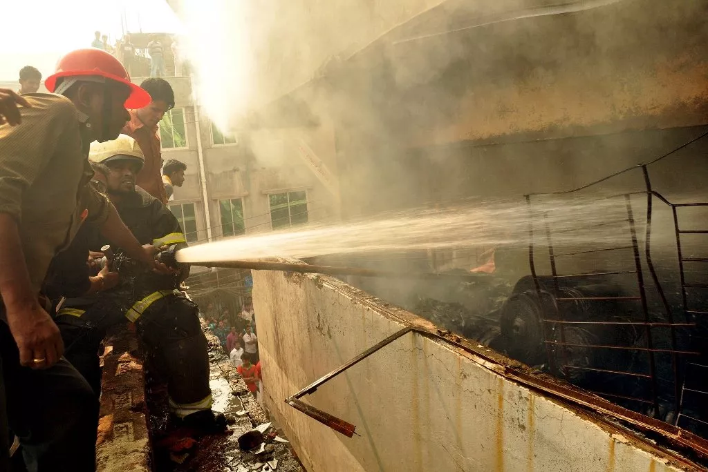 bangladeshi firefighters try and control a fire that broke out at a garment factory on the outskirts of dhaka on november 26 2012 photo afp bangladeshi firefighters try and control a fire that broke out at a garment factory on the outskirts of dhaka on november 26 2012 photo afp