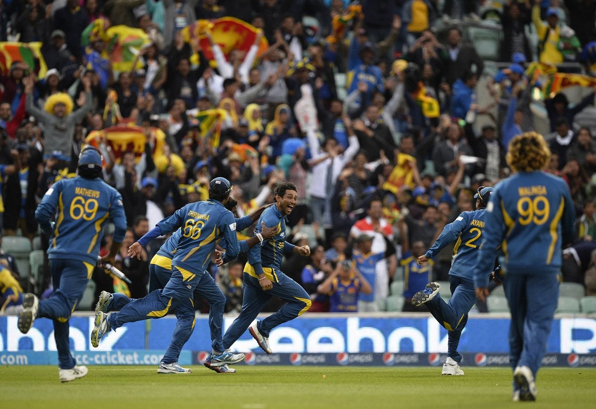 sri lanka 039 s tillakaratne dilshan c celebrates with team mates after taking the catch to dismiss clint mckay the final wicket as they beat australia photo afp