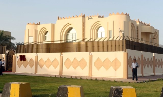 security guards stand outside the new taliban political office in doha before the official opening on june 18 2013 photo afp