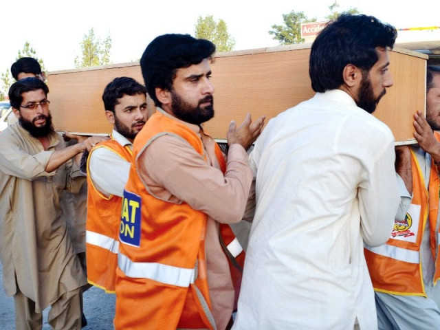 volunteers shift a coffin carrying the body of a victim of the shergarh attack photo afp volunteers shift a coffin carrying the body of a victim of the shergarh attack photo afp