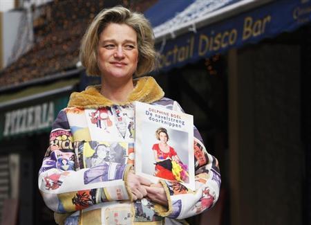 belgian artist delphine boel who says she is the illegitimate daughter of belgian king albert ii poses with her book 039 039 cutting the cord 039 039 in brussels in which she recounts her life and show examples of her art april 9 2008 photo reuters