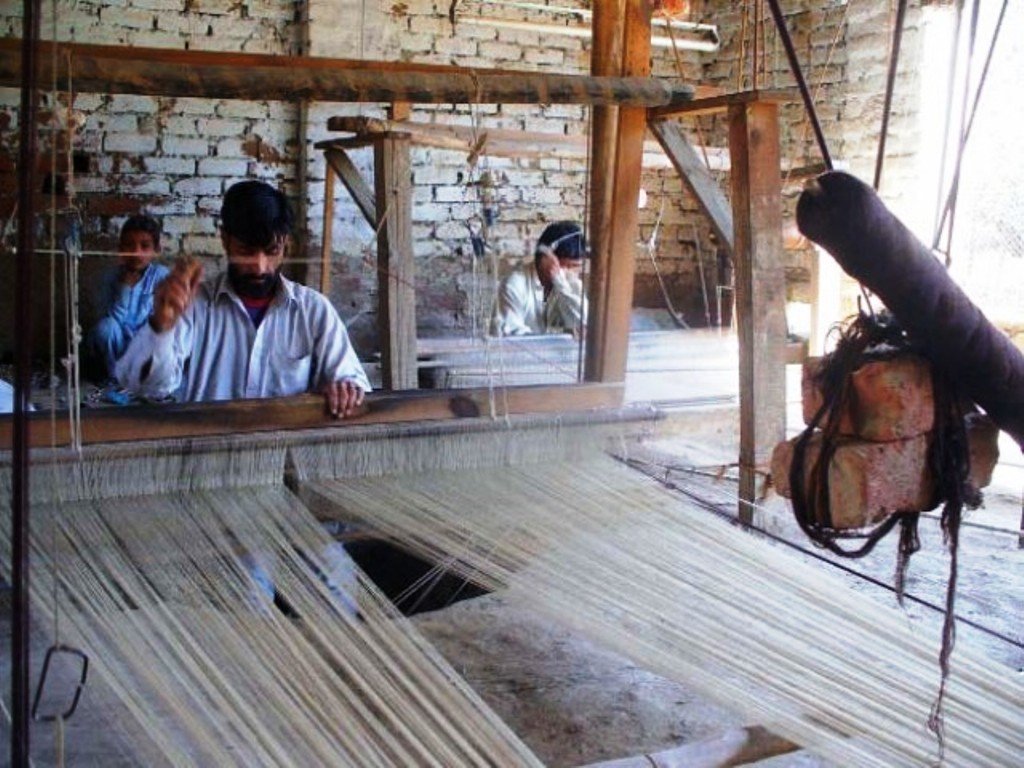 an artisan works at his hand loom in islampur swat photo fazal khaliq express