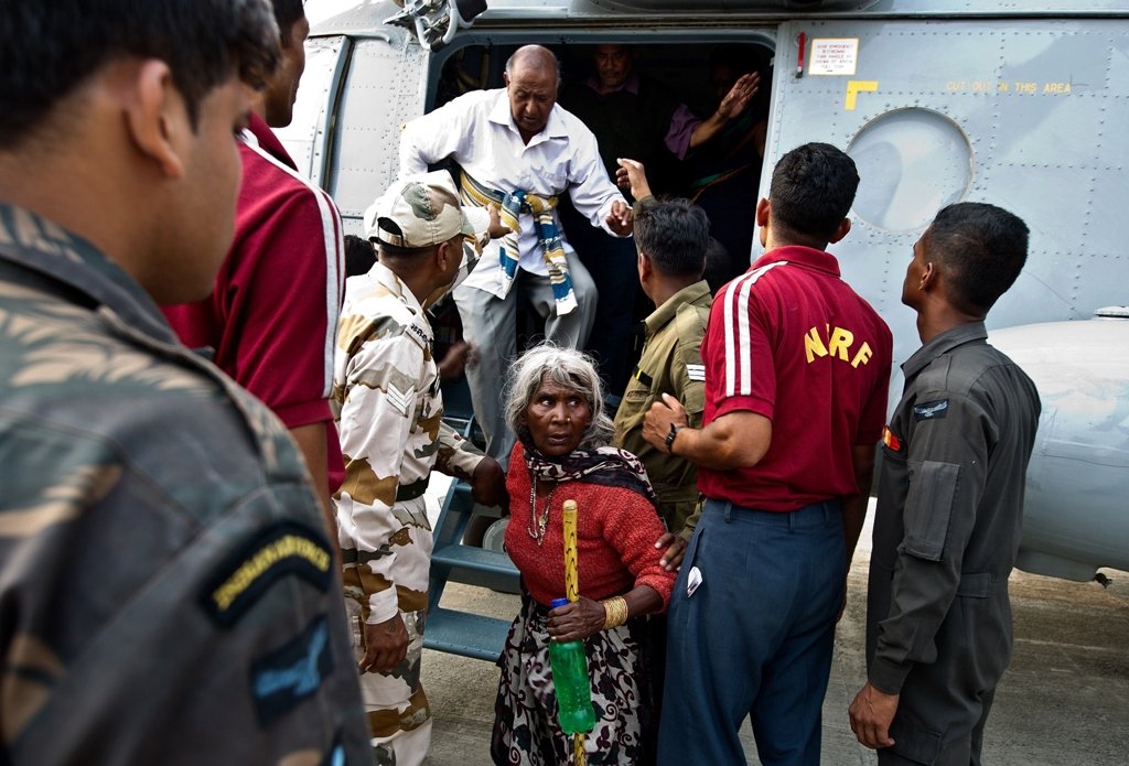 indian pilgrims evacuated from flood hit areas by the indian air force iaf arrive at the jolly grant airport in dehradun state capital of uttarakhand on june 21 2013 photo afp