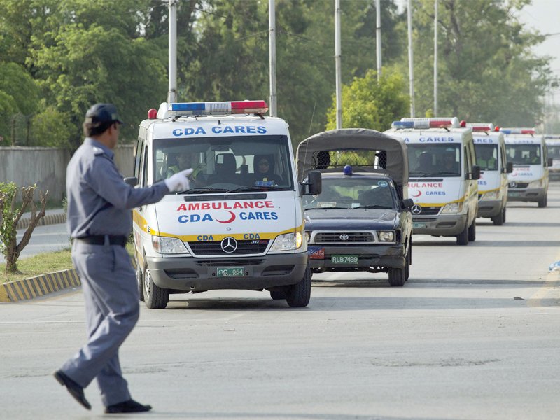 a traffic warden guides ambulances carrying the bodies of foreign tourists photo reuters