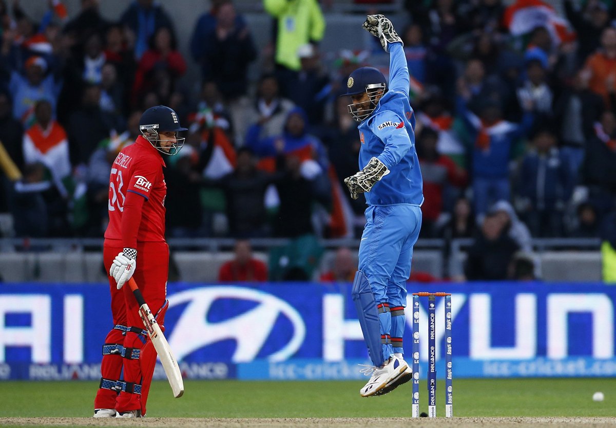 india 039 s mahendra singh dhoni r celebrates victory as england 039 s james tredwell watches during their icc champions trophy final match at edgbaston photo reuters