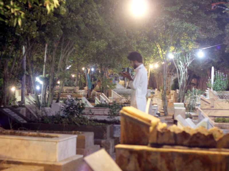 a boy offers prayers at the gizri graveyard on monday night as thousands of muslims observed shab e baraat photo ayesha mir express