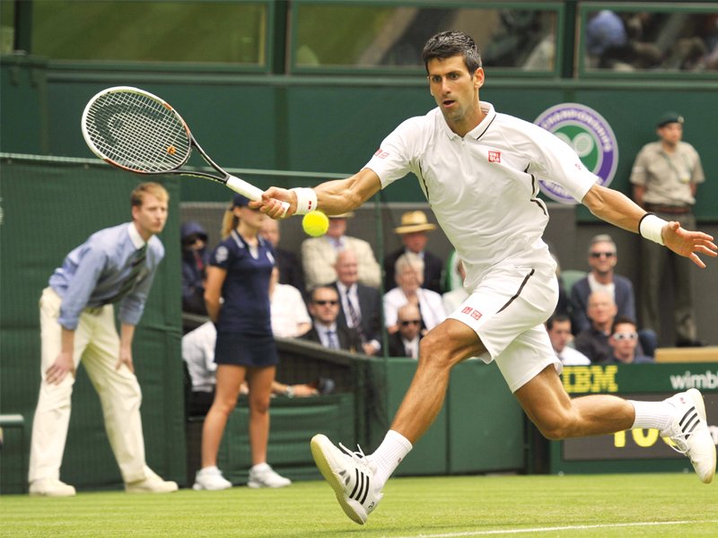 world number one djokovic faced no problems as he eased past mayer in his opening match at wimbledon yesterday photo afp