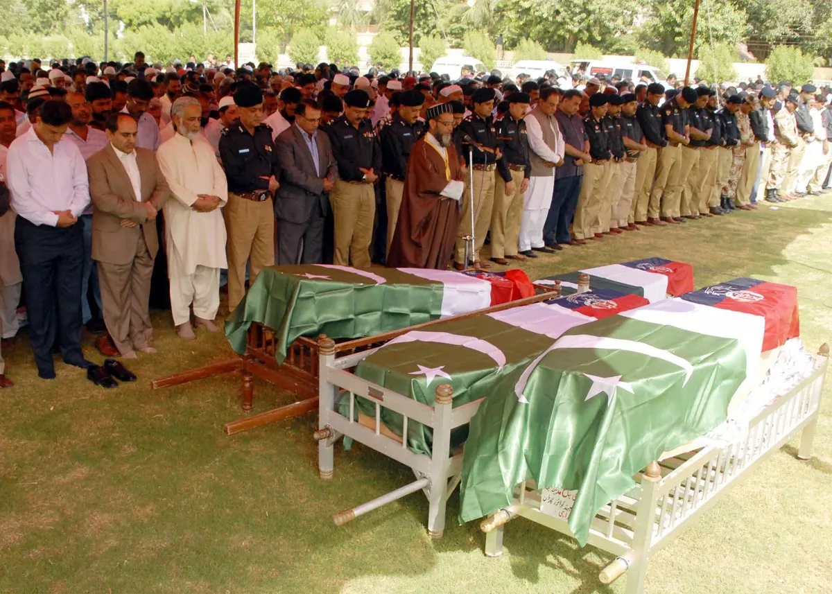 police government officials and relatives offer prayers for the policemen killed in the bomb attack on justice baqar in karachi photo mohammad saqib express police government officials and relatives offer prayers for the policemen killed in the bomb attack on justice baqar in karachi photo mohammad saqib express