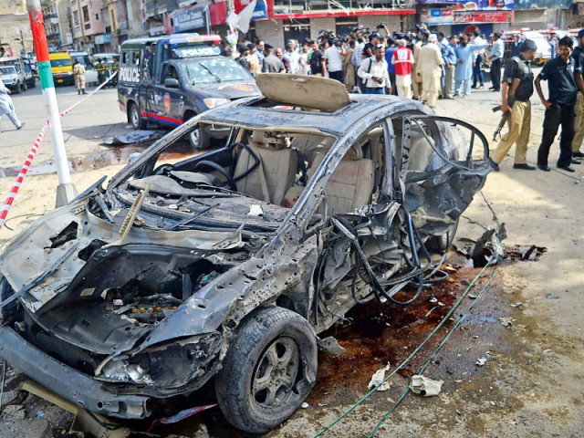 police cordon off the wreckage of justice baqar s car following the blast photo afp police cordon off the wreckage of justice baqar s car following the blast photo afp