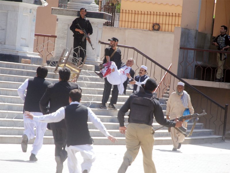 victims of the march 18 attack on the judicial complex in peshawar can be seen being carried by untrained volunteers without the aid of stretchers or medics four people lost their lives and 47 were injured in the suicide and gun attack photos file