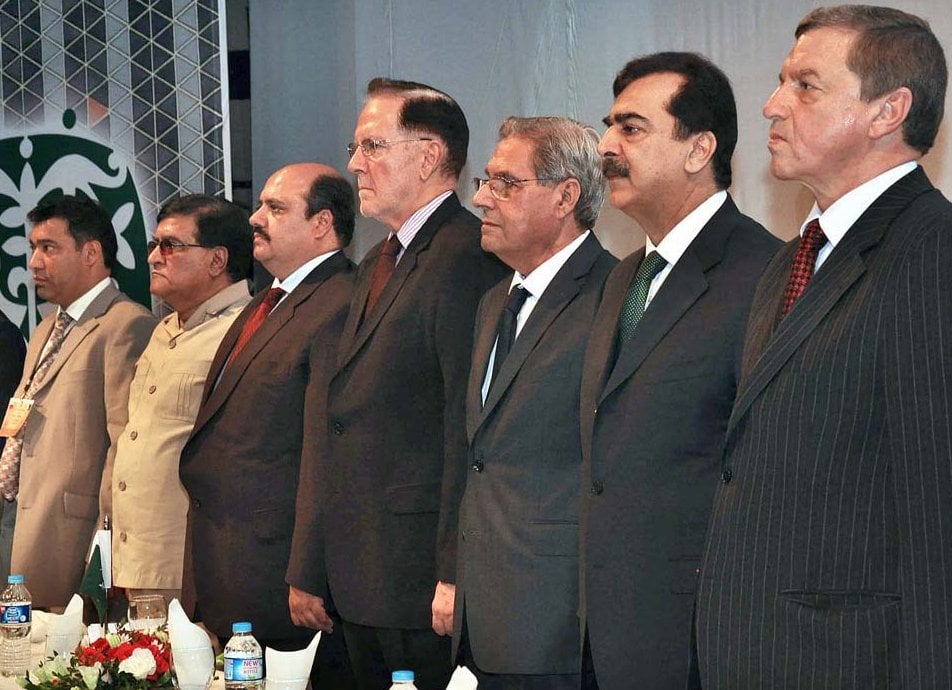 former prime minister yousuf raza gillani russian ambassador andrey s budnik alongwith other guests standing in the respect of national anthem photo app